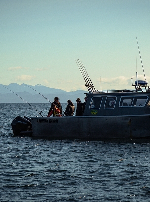 Men fishing on a boat at sea