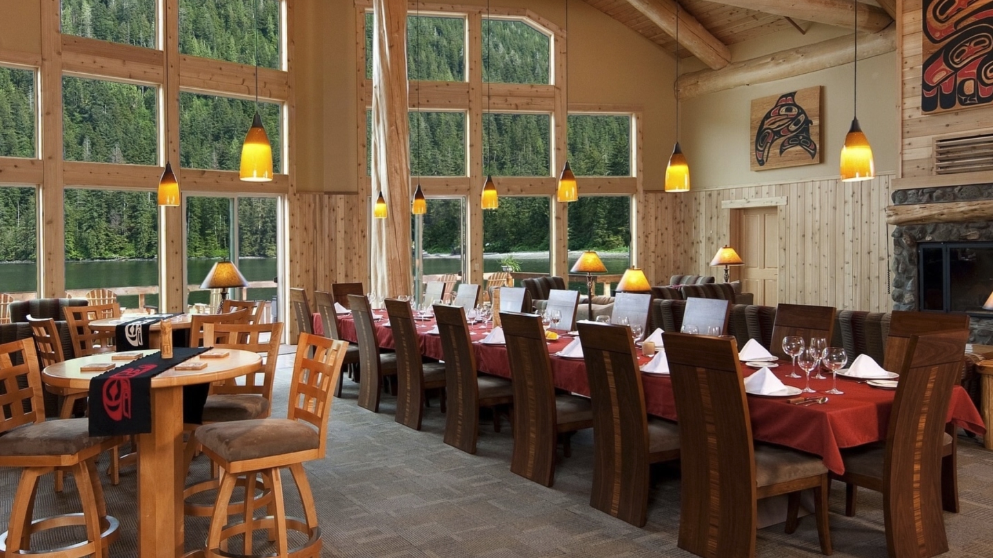 Lodge dining room with set tables and chairs.